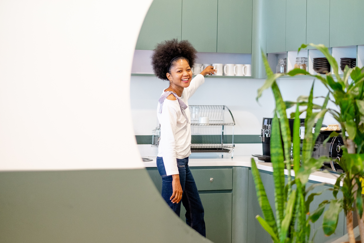 Woman Getting Coffee in Office Pantry